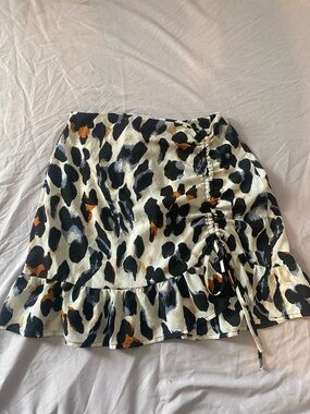 Animal Print Ruffled Mini Skirt in Cream and Black